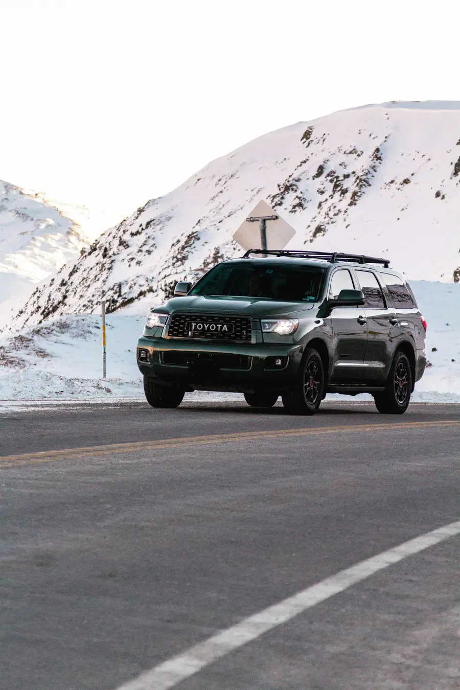 SUV on a snowy Utah mountain road